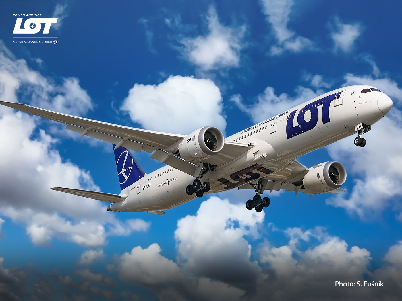 Passenger airplane against a sky with clouds.
